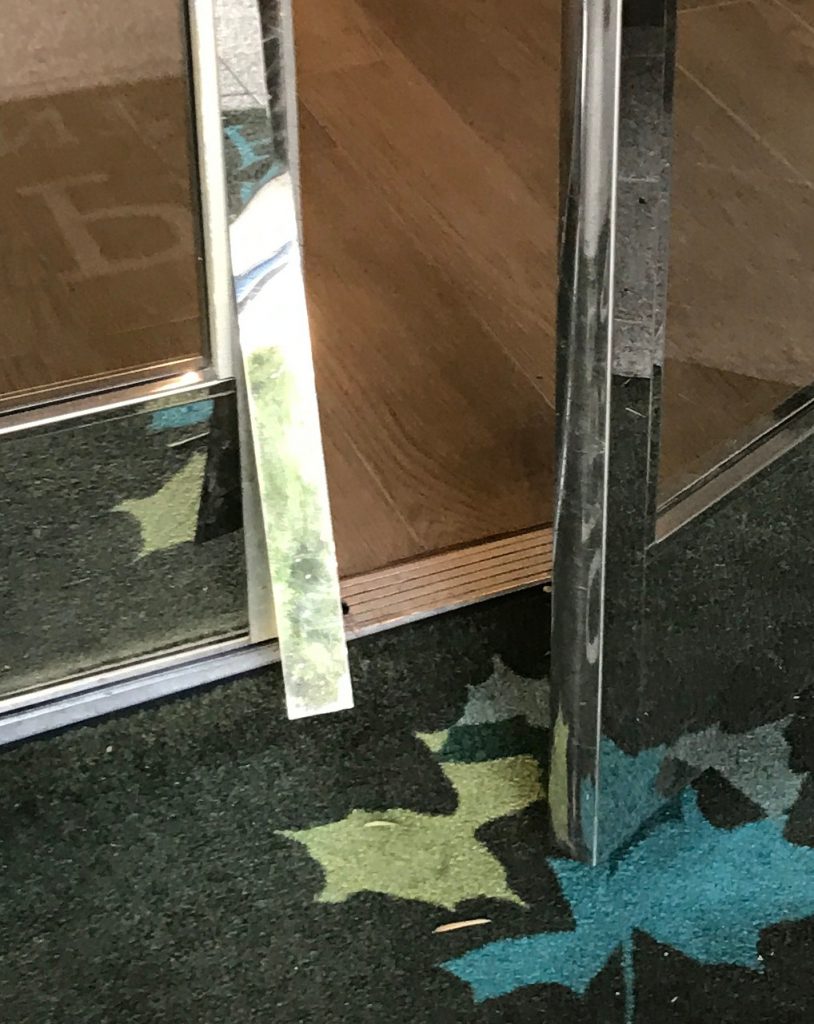 Closeup of Damaged Lobby Door